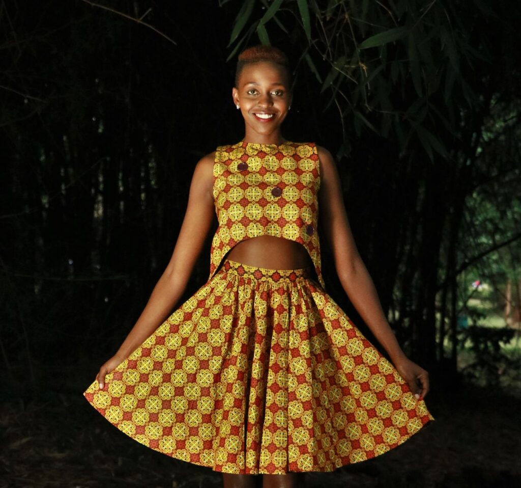 Beautiful African woman posing outdoors in a stylish dress, Nairobi.
